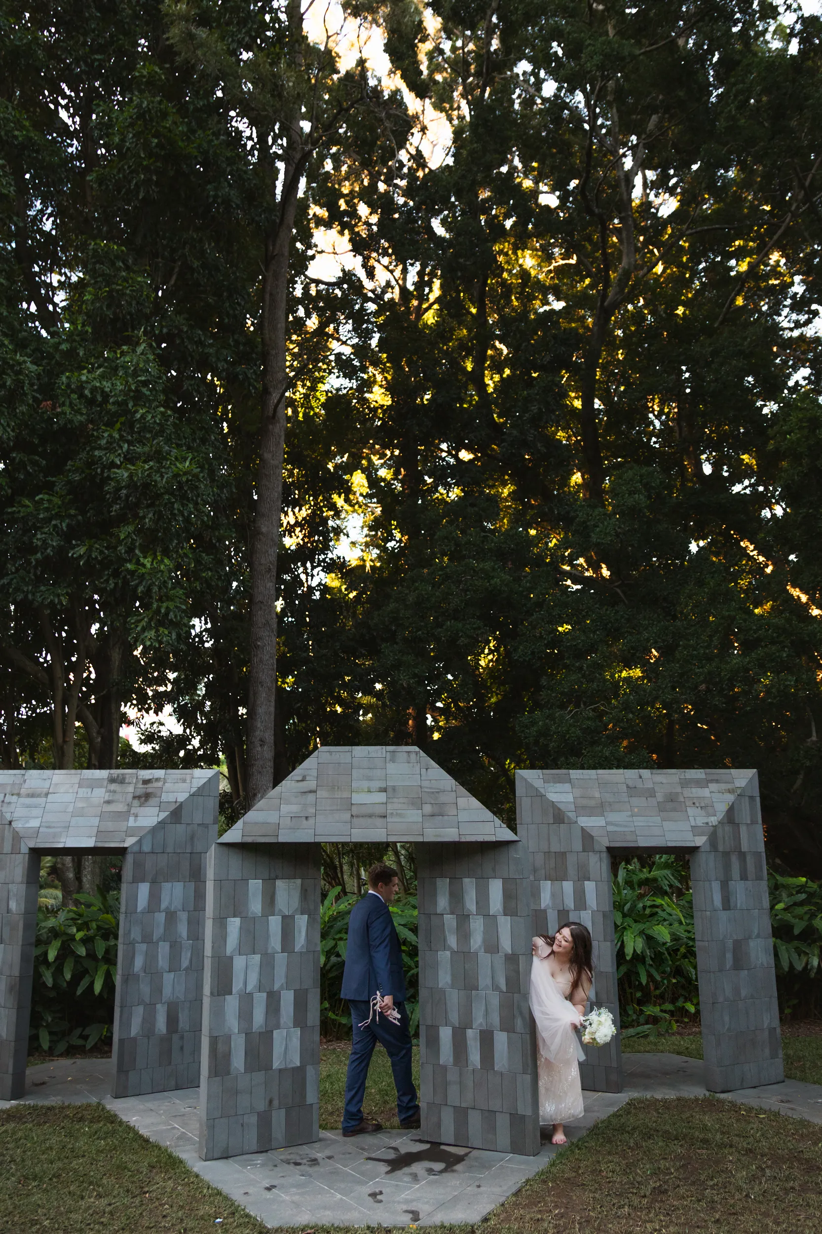 Carlie and Iain unique architectural portrait in modern geometric stone structure with multiple angular openings